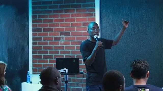 Sigu Magwa presenting to a seated audience at RubyConf Kenya 2019